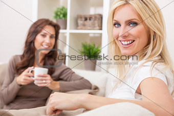 Two Women Friends Drinking Tea or Coffee at Home