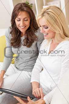 Women Friends Using a Tablet Computer at Home