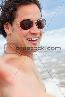 Man at Beach Taking Selfie Photograph