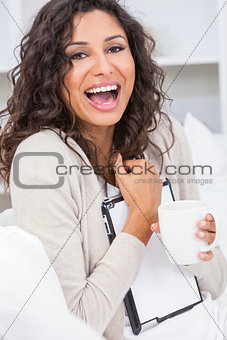 Woman Drinking Tea or Coffee Using Tablet Computer
