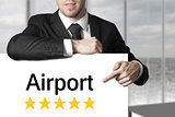 businessman pointing on sign airport