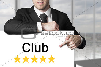 businessman pointing on sign club