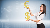 Smiling businesswoman holding dollar and euro signs. Blue gradient background