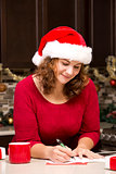 woman writing Christmas card