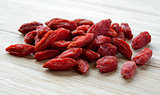 Heap of Dry Goji Berries on the Wooden Table