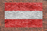 Flag of Austria painted over brick wall
