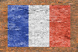 Flag of France painted over brick wall