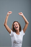 nice woman exulting and laughing rising arms up