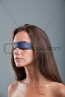 girl with black blind fold