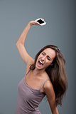 woman throwing a mobile phone