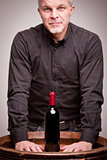 proud wine maker man with a bottle