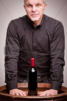 proud wine maker man with a bottle