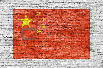 Flag of China painted over brick wall