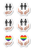 Rainbow, gay and lesbian symbols in heart with hands