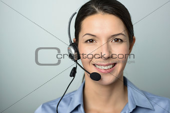 Attractive call center operator wearing a headset