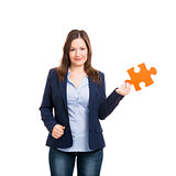 Business woman holding a puzzle piece