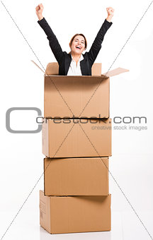 Business woman appear inside a big card box
