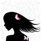Woman profile with pink butterflies