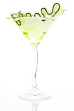 Luxurious cocktail with ice and cucumber garnish isolated.
