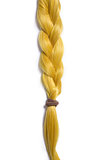 Golden blond hair braided in pigtail 