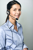 Attractive call center operator wearing a headset