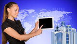 Business woman holds tablet PC, pointing at blank screen