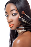 Black woman with straight hair and makeup brushes 