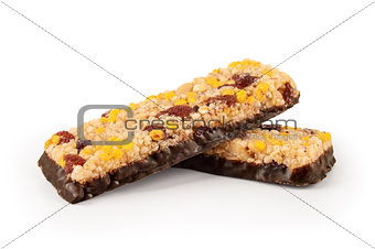 Healthy granola bar with cereals and raisins isolated on white b