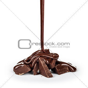 pouring chocolate into pieces isolated on white background