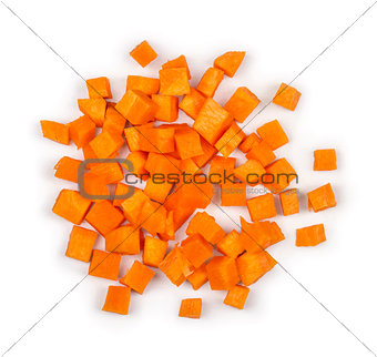 cut into squares pieces of carrot on a white background
