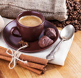 Cup coffee with beans and chocolate candies