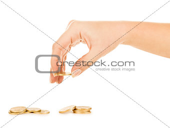 coins fall out of the hands on a pile of gold coins