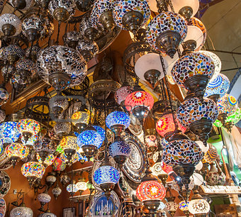 Ornate lamps hanging at a market