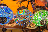 Ornate lamps hanging at a market