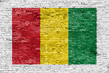 Reggae colors painted over brick wall