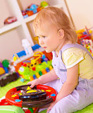 Baby girl in playing room