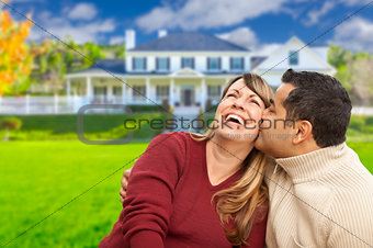 Happy Mixed Race Couple in Front of House