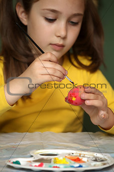 Girl painted Easter eggs