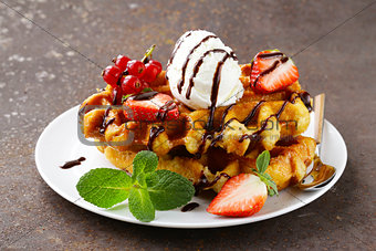 Belgian waffles with berries (currants, strawberries) and ice cream