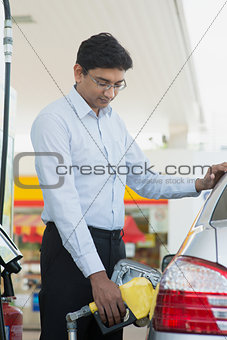 Man pumping gasoline fuel 