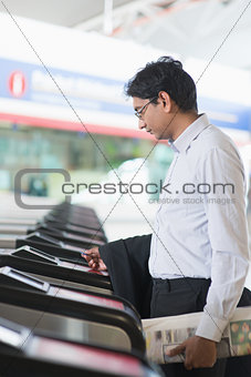 Indian businessman at entrance of railway station