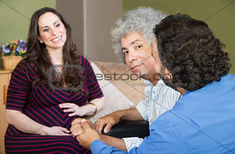 Smiling Surrogate Mother with Gay Couple