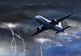 Passenger air plane approaching thunder storm