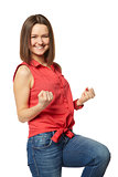 Pretty brunette in blue jeans and a red shirt on white background