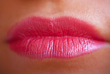 Close-up of woman's lips.  Horizontal macro sexy pale lipgloss make Up