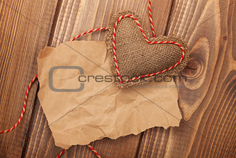 Blank old piece of paper and vintage handmaded valentines day heart