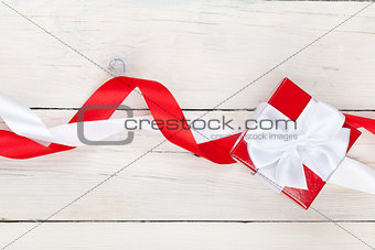 Valentines day background with gift box over white wooden table