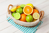 Citrus fruits in basket. Oranges, limes and lemons