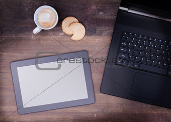 Tablet touch computer gadget on wooden table