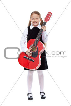 Happy girl with elegant outfit and guitar